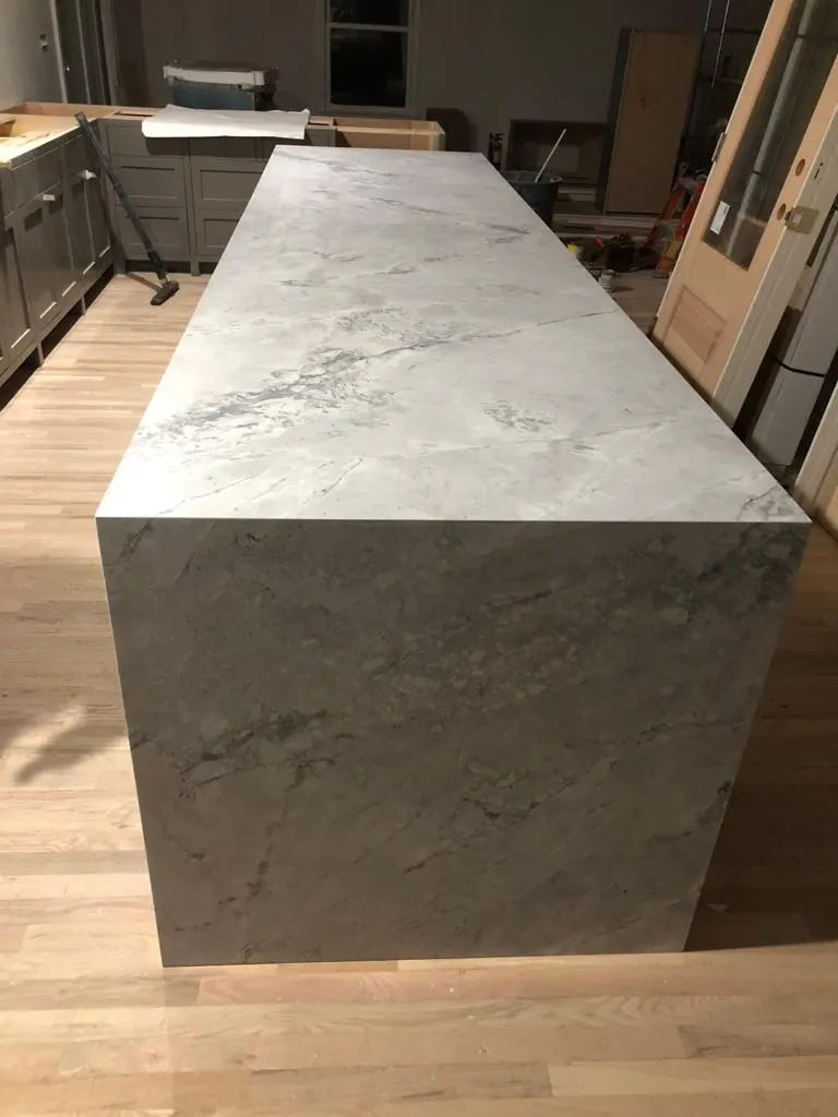 Waterfall island in veined gray stone