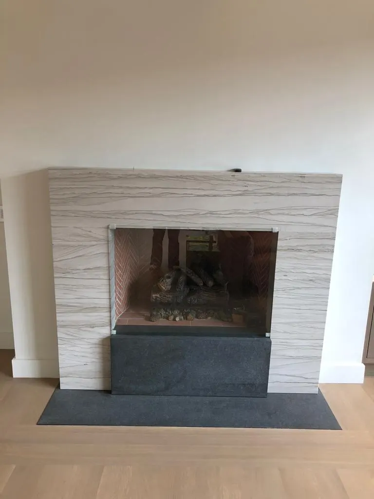 Fireplace surround in stone